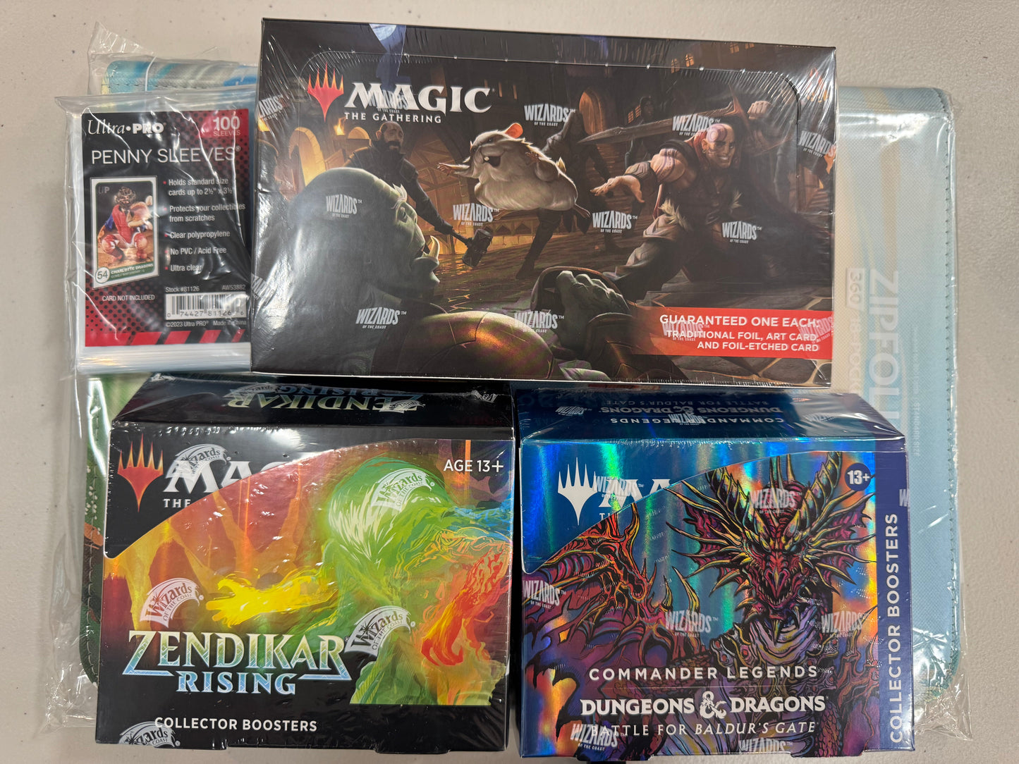 Baldur's Gate Set and Collector box, Plus Zendikar Rising Collector plus a random Zipfolio folder
